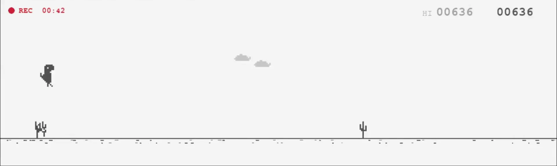 The Dino game mid run, the dinosaur jumping clear of a cactus with the score at 636